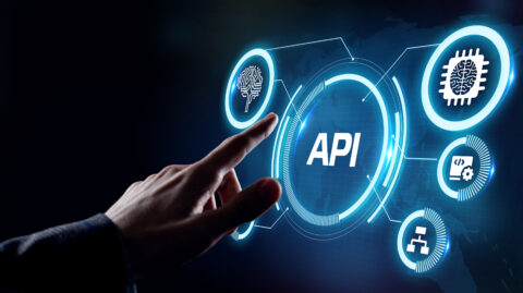 API Application Programming Interface integration Person's hand ready to press a conceptual API option on a touchscreen
