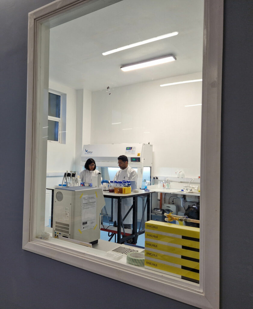 2 microbiologist scientists in discussion at the NuWave laboratory and production factory in County Mayo, Ireland